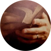 Image of hands thumbing through Bible.
